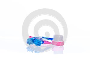 Plastic roller massager and soft bristle brush to stimulate skin blood