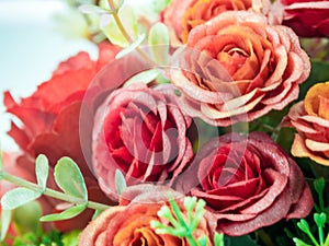 Plastic roses in artificial flower bouquet