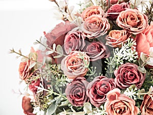 Plastic roses in artificial flower bouquet