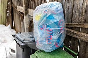 Plastic sack filled with blue plastic mineral water bottles