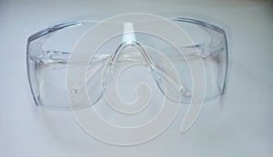 Plastic safety goggles for human eye on white background