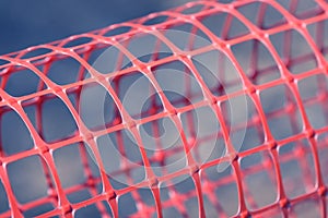 Plastic safety net for construction site. Construction mesh.