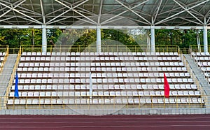 Plastic seats in the stadium. Tribune fans. Seats for spectators in the stadium