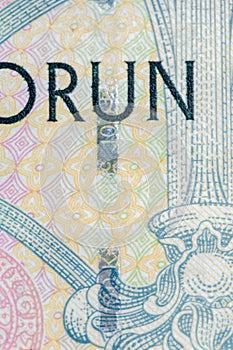 Plastic security strip on 100 CZK banknote.