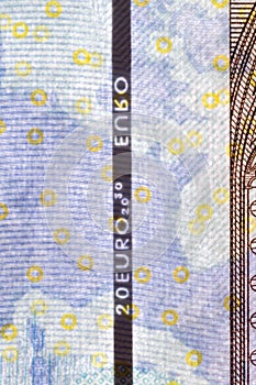 Plastic security strip inside 20 EUR banknote. Security strip on Euro banknote created to prevent counterfeiters