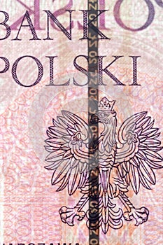 Plastic security strip inside 20 PLN banknote. Security strip on Polish banknote created to prevent counterfeiters