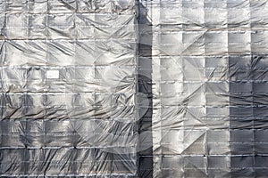 Plastic sheeting on scaffolding