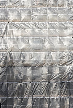 Plastic sheeting on scaffolding