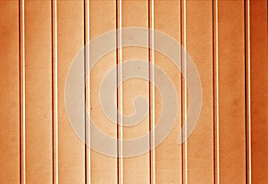Plastic siding surface in orange tone