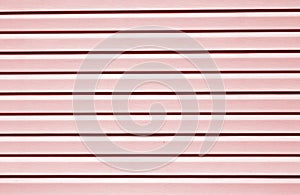 Plastic siding surface in red tone.