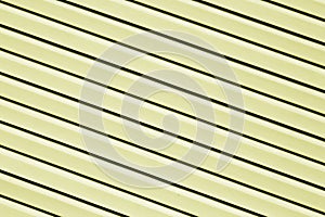 Plastic siding surface in yellow color.