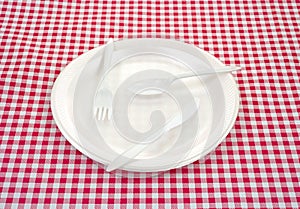 Plastic silverware on plate