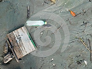 Plastic soda bottle discarded contaminating the beach in cartagena colombia copy space