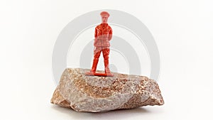 Plastic soldier on a stone