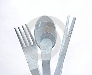 plastic spoon, fork,and chopsticks on white background