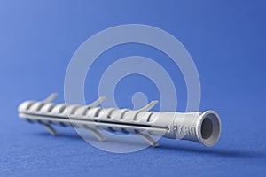 Plastic Straddling Dowel On blue Background