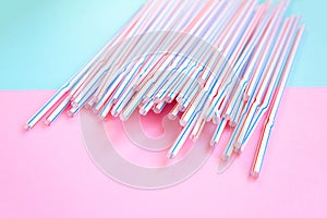 Plastic straws for cocktails. Pastel pink and blue colors. Summer vibes. Hipster party with beverages