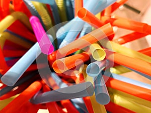Plastic straws extreme close up multi colored waste drinking straw