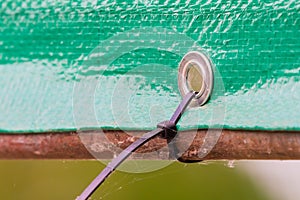 Plastic stripe pies for banner fixing