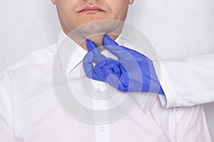 Plastic surgeon doctor prepares a young caucasian man for a double chin fat surgery, thyroid gland, portrait photo