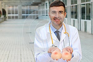 Plastic surgeon holding silicon implants
