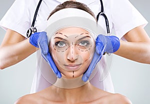 Plastic surgery - Beautiful woman face, with surgical markings