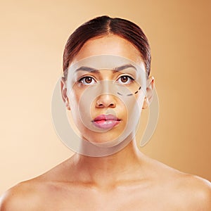 Plastic surgery, cosmetics and woman with surgical lines on face in brown studio background with skincare. Portrait