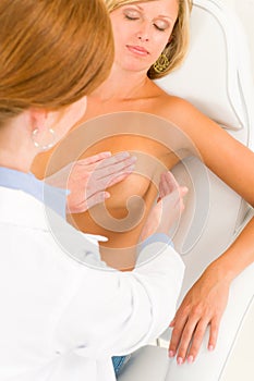 Plastic surgery doctor examine patient breast