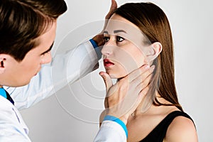 Plastic surgery doctor, patient inspection and consultation photo