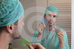 Plastic surgery patient checking his face symmetry