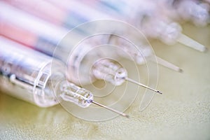 A plastic syringe(disposable syringe) with liquid(fluid), chemical at the laboratory, hospital white.