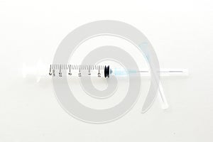 Plastic syringe isolated on white background