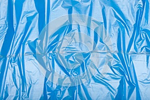 Plastic texture of blue crumpled bag cellophane