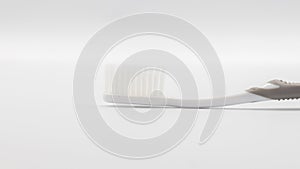 Plastic toothbrush on grey background