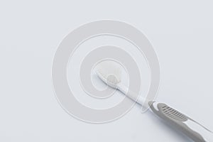 Plastic toothbrush on grey background