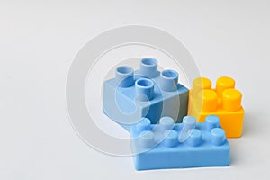 Plastic toy building blocks isolated on a white background