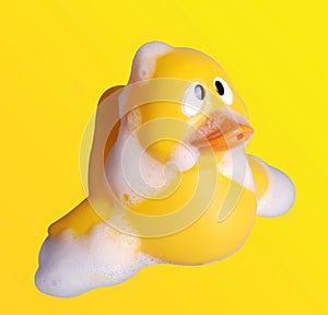 Plastic toy duck with soap bubble