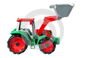 Plastic toy green with red tractor isolated on white background