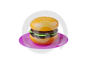 Plastic toy hamburger on the dish