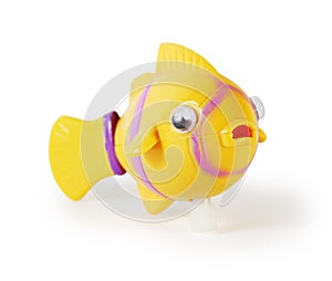 Plastic toy mechanical fish isolated