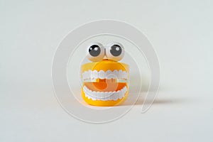 Plastic toy teeth isolated on a white background