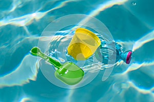 plastic toys floating in swimming pool