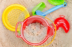 Plastic toys in sandpit