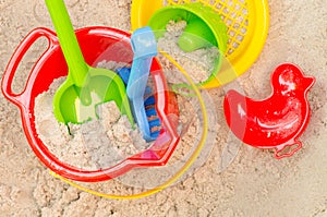 Plastic toys in sandpit