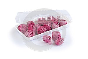 Plastic transparent container with homemade currant marshmallow.