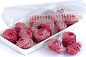 Plastic transparent container with homemade currant marshmallow.