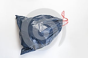 plastic trash bag package full of rubish on the colorful background isolated,