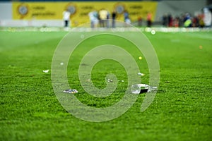 Plastic trash on the turf on a soccer field