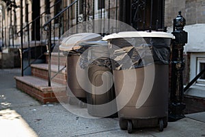 Plastic Trash Cans Outside an Apartment Building in Astoria Queens of New York City