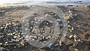 Plastic trash and other marine garbage on tropical sandy beach